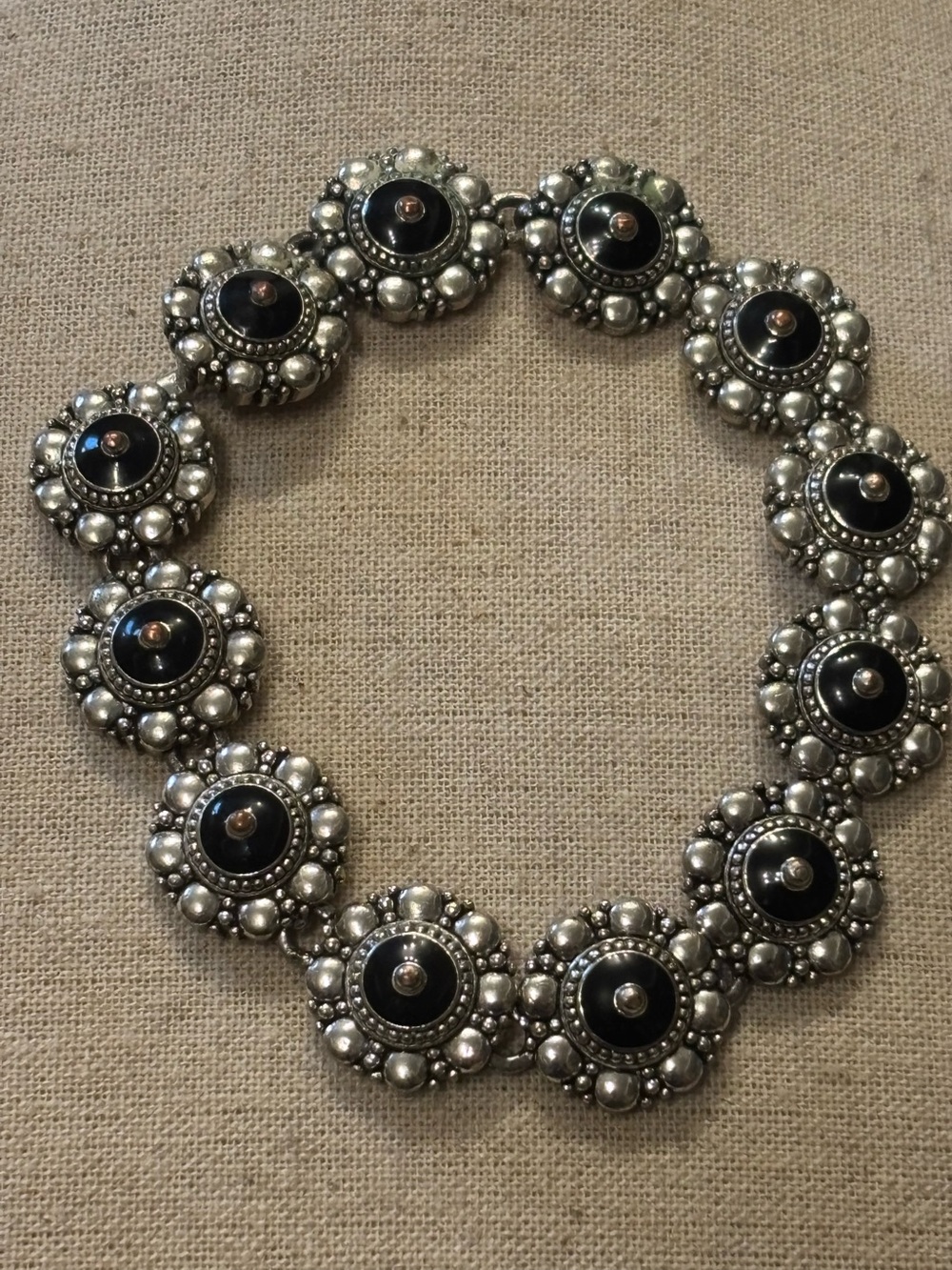 Avon signed Black and Silver Floral Button bracelet w/magnetic clasp